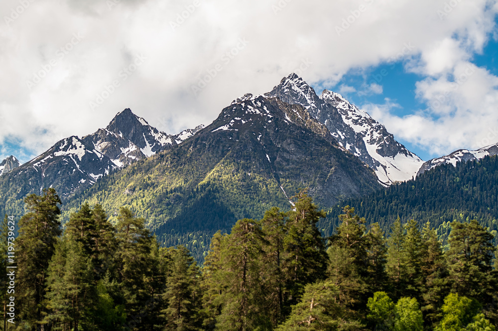 mountain peaks against the blue sky