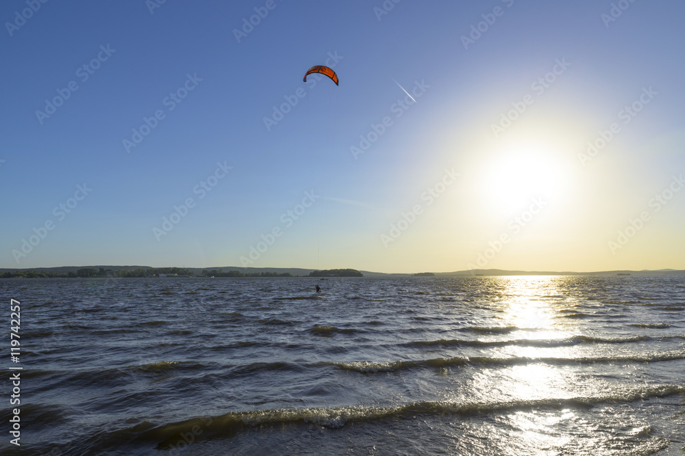 Slipping through the waves with a parachute Slipping through the waves with a parachute