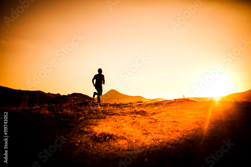 silhouette of man in the mountainous area athletes © mehmetcan