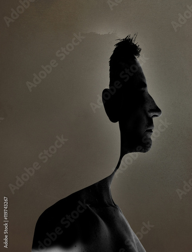 surrealistic portrait of a young man with cut out profile