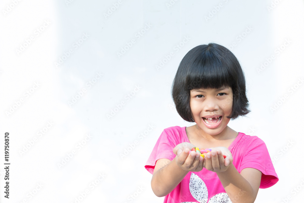 little girl and broken teeth with sweet candy on white bacground little girl and broken teeth with sweet candy on white bacground