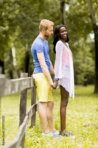 Loving couple by tge fence photo