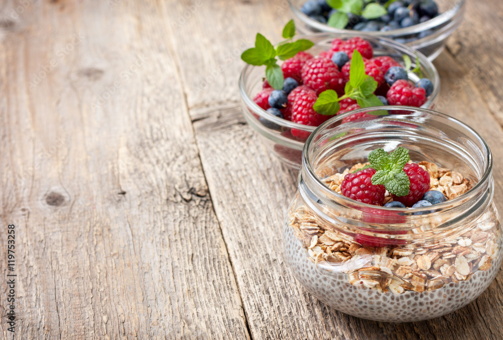 Chia pudding with muesli, raspberries, blueberries Chia pudding with muesli, raspberries, blueberries