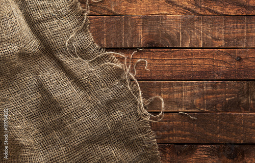 Burlap texture on wooden background