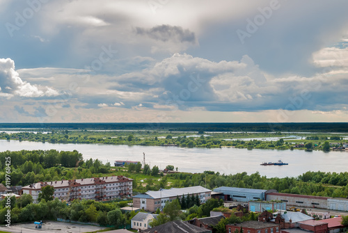 Tobolsk, Russia - July 15, 2016: Little ferry is transported through Irtysh river © Aikon