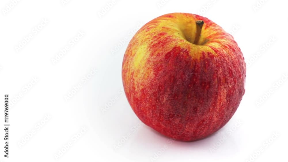 Video of fresh red apple with water drops rotating at white background. Vegetable background. Full Hd stock footage clip.
Video of fresh red apple with water drops rotating at white background. Vegetable background. Full Hd stock footage clip.