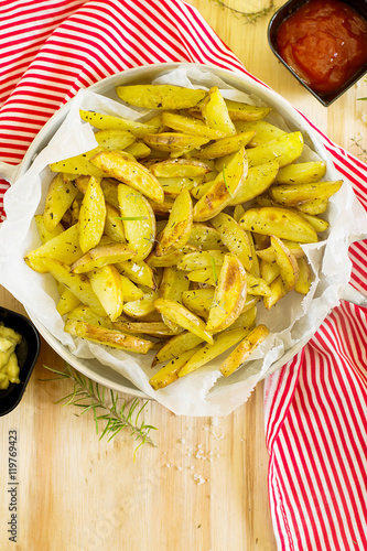 Roasted potato wedges with herbs photo