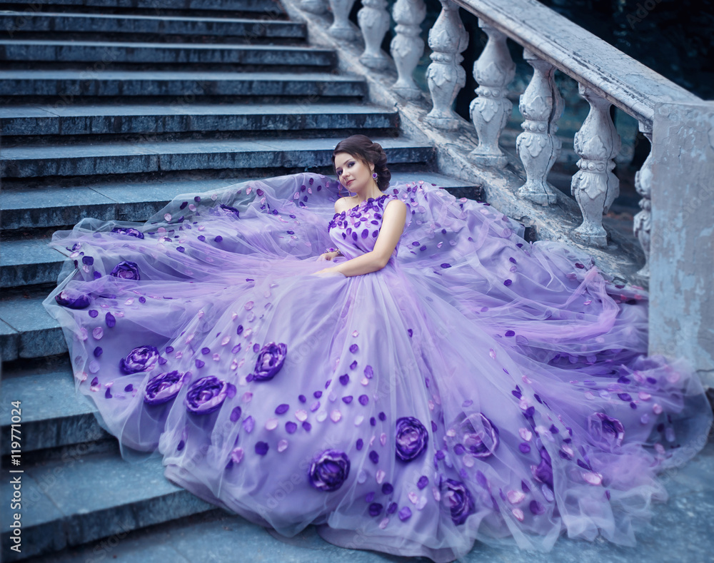 Beautiful, young, brunette in a luxurious, purple, long dress ...