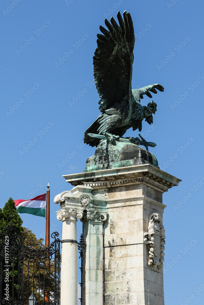 Statue of Turul, a mythological bird of prey and Hungary flag