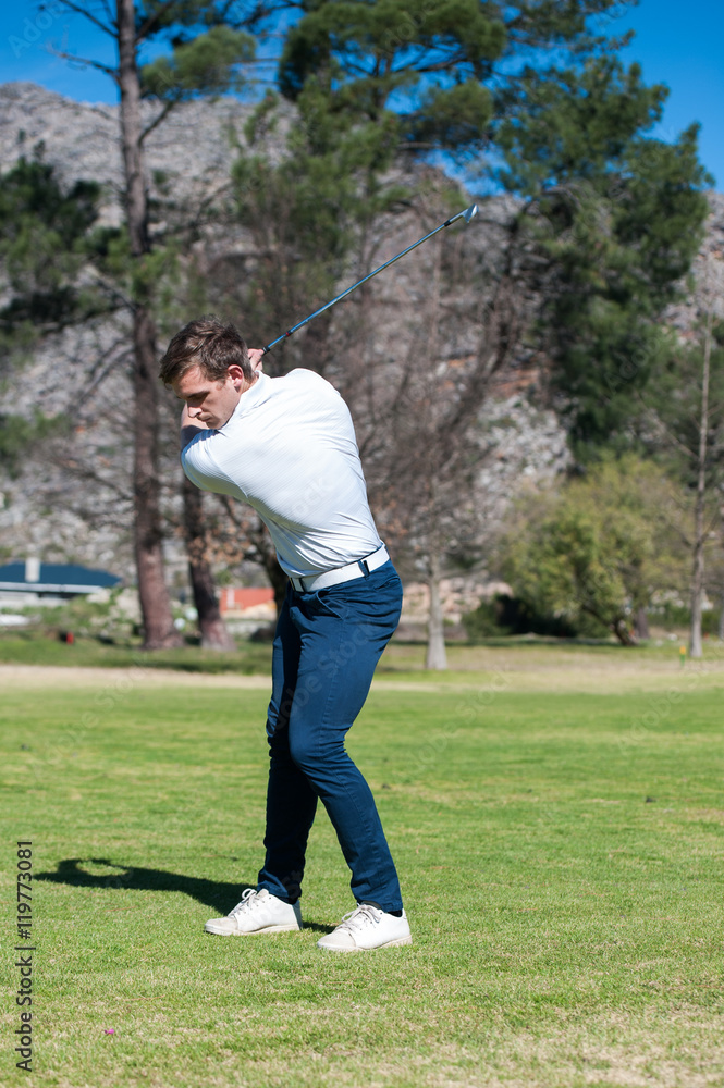 golfer playing a shot on the fairway golfer playing a shot on the fairway