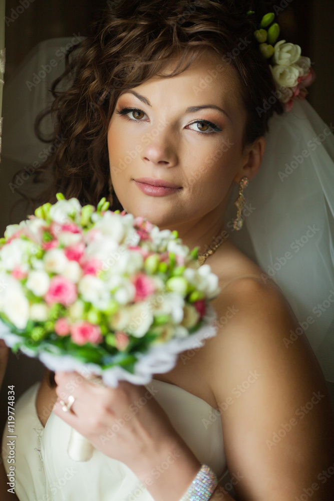 Beautiful bride wedding with makeup and hairstyle. Stylist makes make-up bride on wedding day. portrait of young woman at morning. Beautiful bride wedding with makeup and hairstyle. Stylist makes make-up bride on wedding day. portrait of young woman at morning.