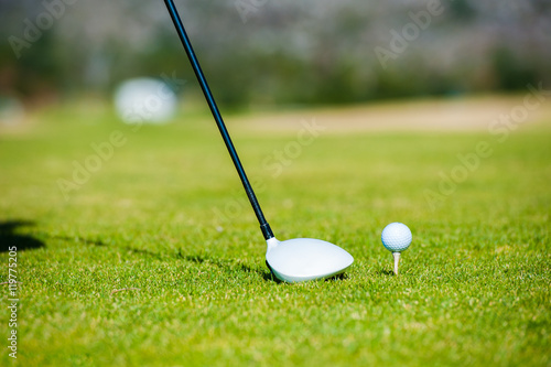 view of a golfer teeing off from a golf tee