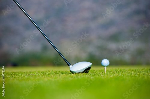 view of a golfer teeing off from a golf tee