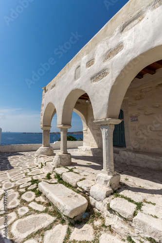 Amazing White chuch and seascape in town of Parakia, Paros island, Cyclades, Greece photo