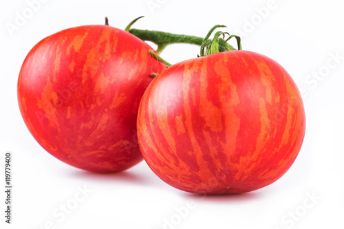 Fotografi Tomatoes striped tomato closeup, Tigerella cultivar