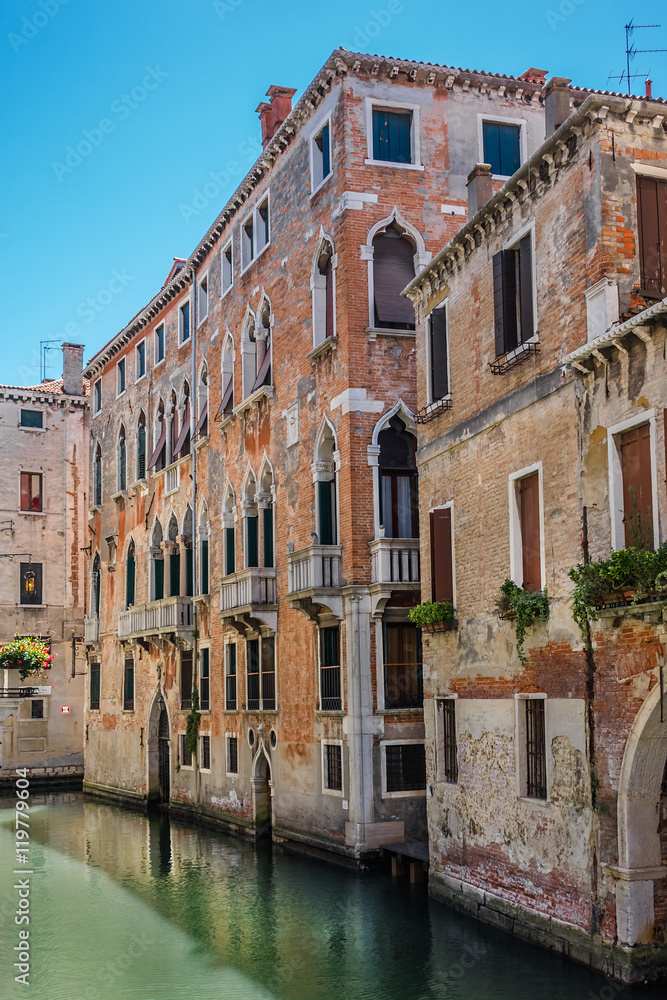 Canal with beautiful medieval facades. Venice, Italy.