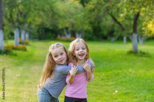 Two cute girls playing in the par