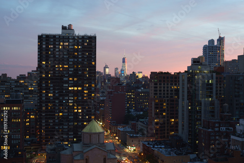 Dark Manhattan cityscape  colorful sunset