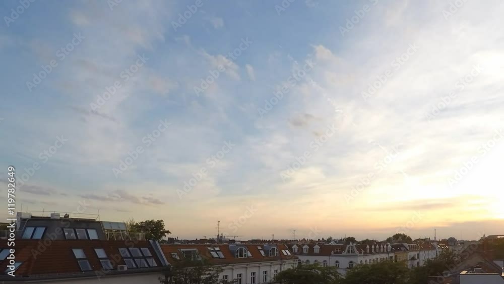sunset sky and clouds over city skyline - time lapse sunset sky and clouds over city skyline - time lapse