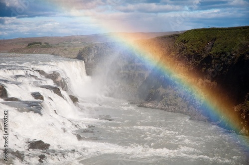 waterfall with beautiful genuine rainbow