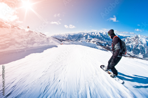 snowboarder riding fast, motion blur, fisheye shot