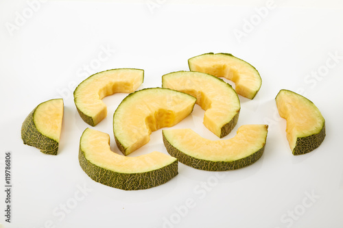 Hamigua Melon cut into slices, Hami Melon, Hami Cantaloupe isolated on white background. photo