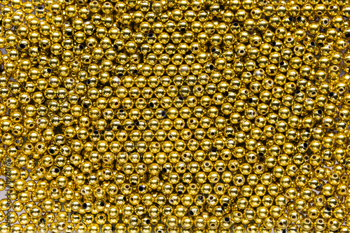 Golden bead background © sirirak