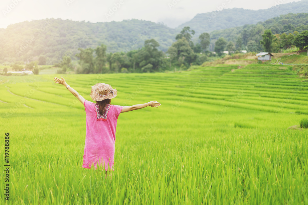 Woman traveler looking green rice terraces field in Chiangmai Th Woman traveler looking green rice terraces field in Chiangmai Th