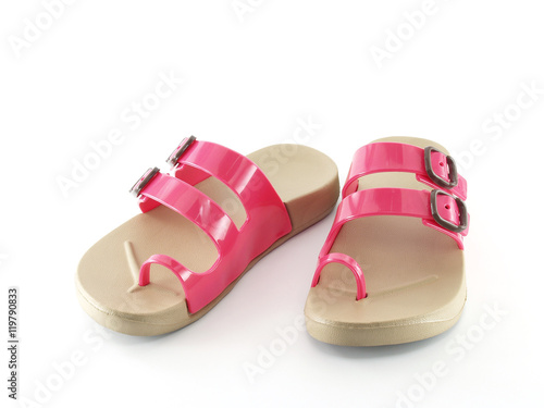 pair of children sandal with trump finger strap and beige rubber sole isolated on white