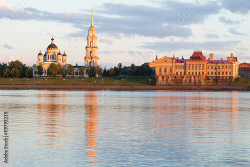 View of the Spaso-Preobrazhensky Cathedral and the corn exchange building on the Volga embankment July evening. Rybinsk, Russia