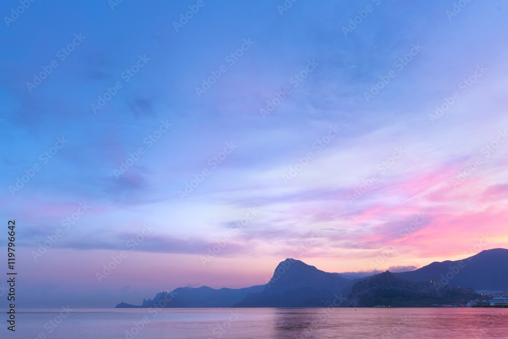 sunset on a background of mountains