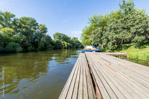  Wooden pier on the river in summer 