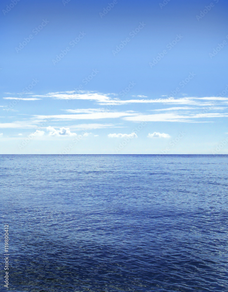 Open water with copy space. Sea scene and fluffy clouds.
