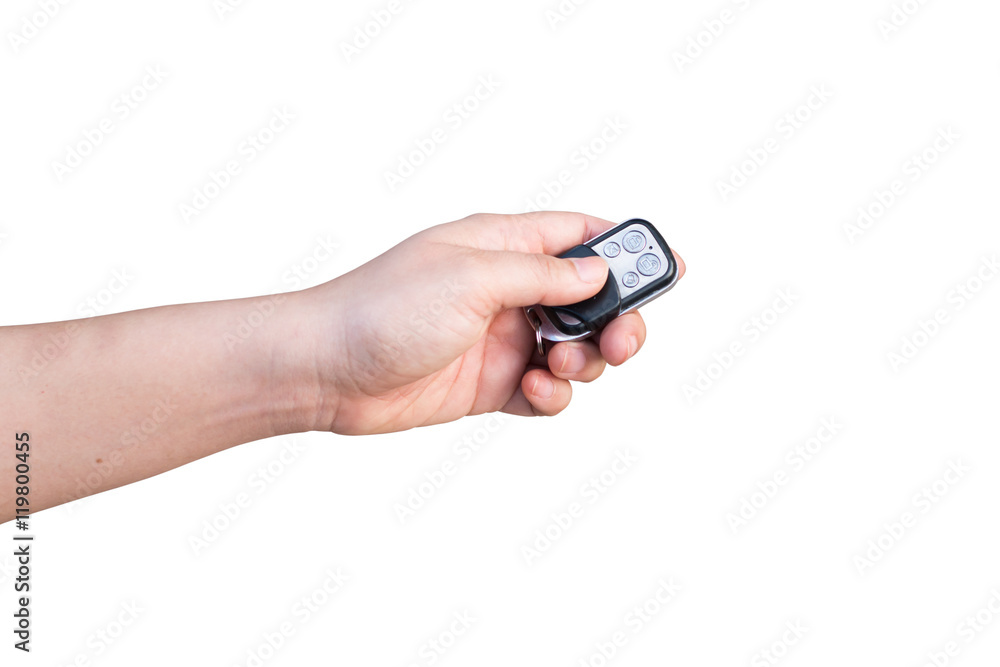 Hand holding car key isolated on white background Hand holding car key isolated on white background