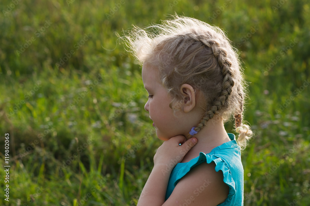 Girl child with curly white hair in rays of sun Girl child with curly white hair in rays of sun