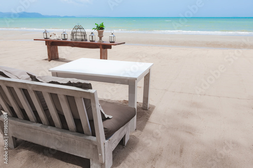 Sofa and table on the beach © Mckyartstudio