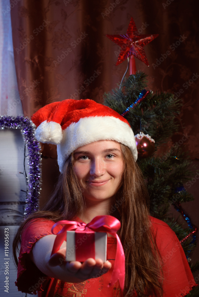 Cute girl with gift in hand,