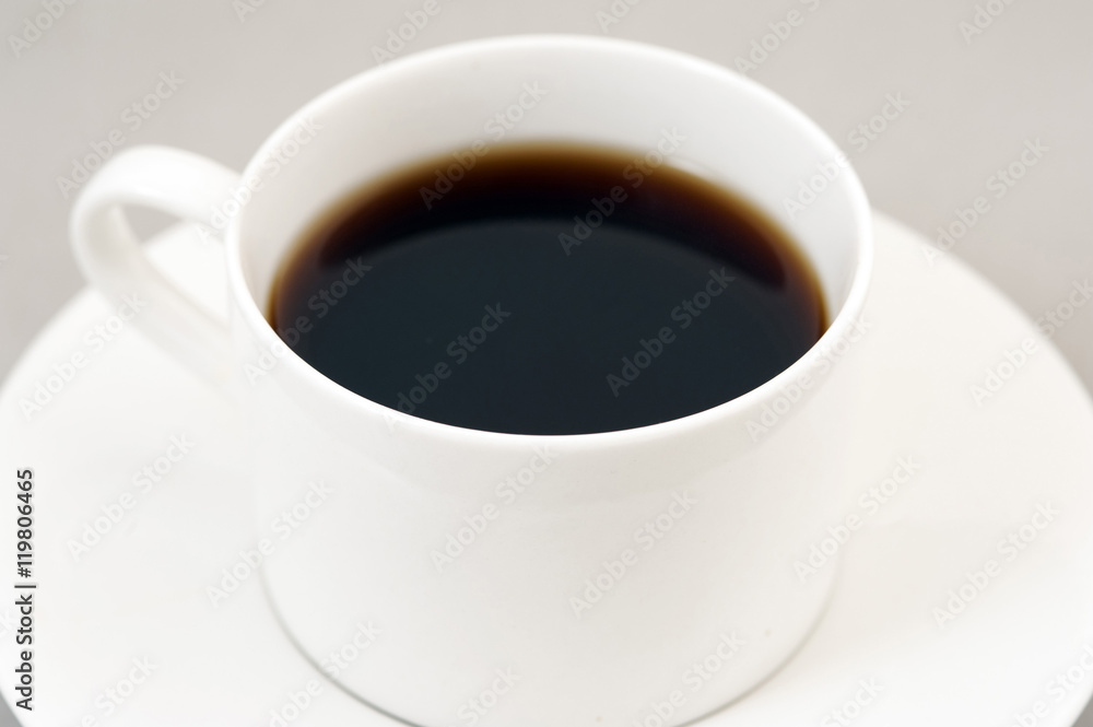 Black energizing coffee served in a white cup Black energizing coffee served in a white cup