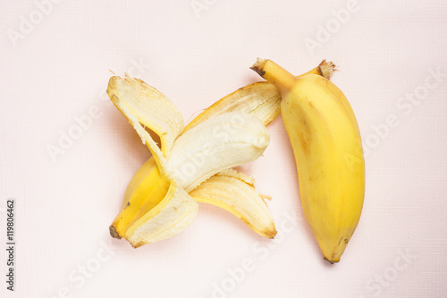 Thick bananas taste like apples on pink background photo