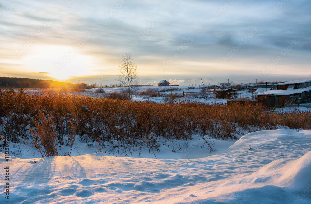 Winter sunset in the village, Russia, Ural Winter sunset in the village, Russia, Ural