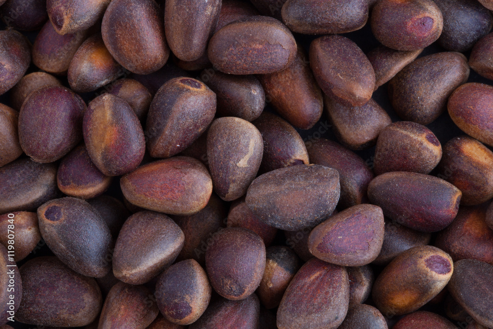 Pine nuts in shells. Background.