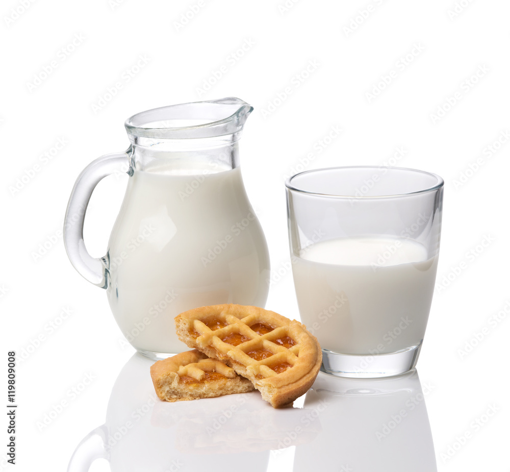 Jug and glass with milk and cookies with jam isolated on white background Jug and glass with milk and cookies with jam isolated on white background