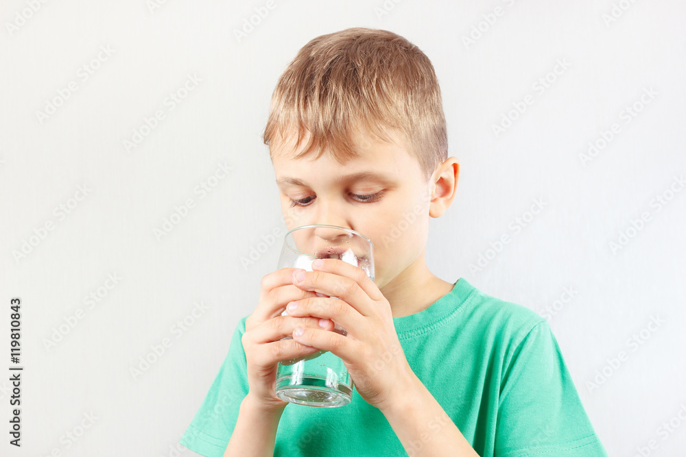 Little blonde boy drinking a fresh mineral water Little blonde boy drinking a fresh mineral water