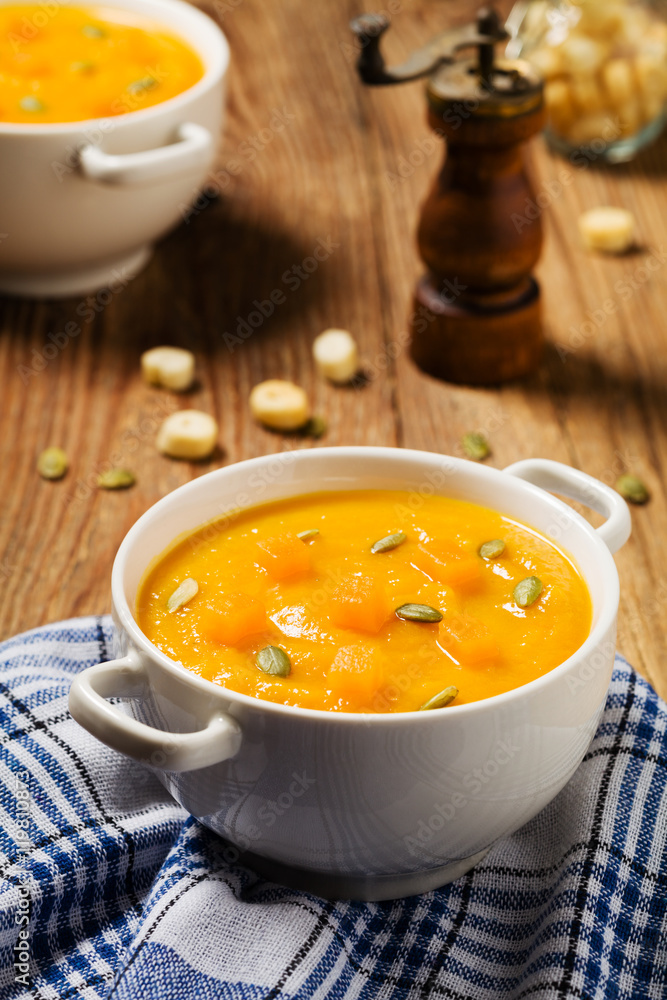 soup, cream of pumpkin served with roasted seeds and croutons. soup, cream of pumpkin served with roasted seeds and croutons.