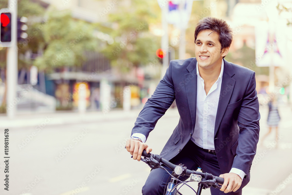 Successful businessman riding bicycle Successful businessman riding bicycle