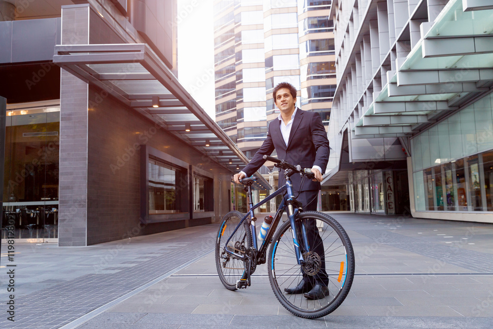 Successful businessman with bicycle Successful businessman with bicycle