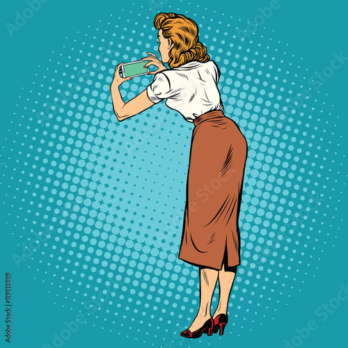 Woman back photographed on a smartphone