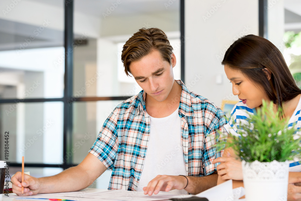 Two office workers at the desk Two office workers at the desk