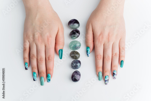 Closeup of woman hands with colorful nails photo