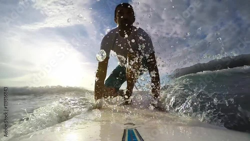 surfing at sunset in cinemagraph effect